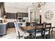 Spacious kitchen with stainless appliances and adjacent dining area, perfect for Gathering meals and entertaining at 1659 N Channing --, Mesa, AZ 85207