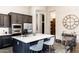 Spacious kitchen island with sleek counters, seating, and modern appliances create a welcoming and functional space at 1659 N Channing --, Mesa, AZ 85207
