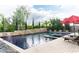 Expansive backyard pool area featuring a spa, water features, landscaping, and a lounging area with chairs at 1659 N Channing --, Mesa, AZ 85207