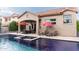 Luxurious pool and patio area with comfortable outdoor seating and shade umbrellas for relaxation at 1659 N Channing --, Mesa, AZ 85207