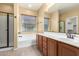 Bright bathroom featuring a tub, shower, double sink vanity and natural light through window at 18434 E El Buho Pequeno Rd, Gold Canyon, AZ 85118