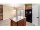 Bright kitchen with a center island, stainless steel refrigerator, and lots of natural light from a nearby window at 18434 E El Buho Pequeno Rd, Gold Canyon, AZ 85118