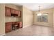 Comfortable office with built-in desk and cabinets, offering an ideal workspace for productivity and organization at 18434 E El Buho Pequeno Rd, Gold Canyon, AZ 85118