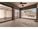 Enclosed patio with screens offering seamless indoor/outdoor living, plus an outdoor grill at 18434 E El Buho Pequeno Rd, Gold Canyon, AZ 85118