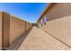 Side yard is landscaped with gravel and desert plants for low maintenance at 18434 E El Buho Pequeno Rd, Gold Canyon, AZ 85118