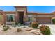 Charming single-story home with desert landscaping, flowers, and a tile roof at 18547 W Sweet Acacia Dr, Goodyear, AZ 85338