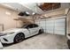 Spacious two car garage featuring ample storage and a clean, well-maintained floor at 18547 W Sweet Acacia Dr, Goodyear, AZ 85338