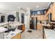 Open kitchen with stainless steel appliances, light wood cabinetry, and a seamless flow to the living space at 18547 W Sweet Acacia Dr, Goodyear, AZ 85338