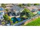 Aerial view of home with swimming pool, backyard putting green, shed, and beautiful landscaping at 1974 E Dubois Ave, Gilbert, AZ 85298
