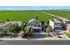 Aerial view of home with solar panels showcasing desert landscaping and location near green fields at 1974 E Dubois Ave, Gilbert, AZ 85298