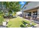 Inviting backyard with a putting green, covered patio, and outdoor seating perfect for entertainment at 1974 E Dubois Ave, Gilbert, AZ 85298