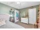 The serene bedroom features a bed with neutral linens, soft lighting, and simple decor for a calming retreat at 1974 E Dubois Ave, Gilbert, AZ 85298