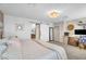 Cozy bedroom showcasing an office space, a barn door leading to the bathroom, and neutral tones at 1974 E Dubois Ave, Gilbert, AZ 85298