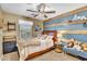 Inviting bedroom with wood accents, stylish decor, a window, and comfortable furnishings for a cozy retreat at 1974 E Dubois Ave, Gilbert, AZ 85298