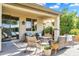 Inviting covered patio with comfortable seating, perfect for relaxing and enjoying the outdoor space at 1974 E Dubois Ave, Gilbert, AZ 85298