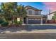 Charming two-story home featuring a two-car garage and desert landscaping at 1974 E Dubois Ave, Gilbert, AZ 85298