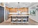 Open kitchen featuring a large island with granite countertops and stainless steel appliances at 1974 E Dubois Ave, Gilbert, AZ 85298