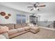 Upstairs living room with comfortable seating, a ceiling fan, a cabinet and staircase access at 1974 E Dubois Ave, Gilbert, AZ 85298
