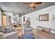 Spacious living room with comfortable seating, and stairs leading to second story at 1974 E Dubois Ave, Gilbert, AZ 85298