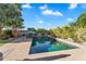 Serene backyard pool surrounded by lush greenery and patio space, perfect for tranquil outdoor living at 1974 E Dubois Ave, Gilbert, AZ 85298