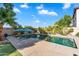 Backyard pool featuring an umbrella and loungers providing relaxation in a private outdoor setting at 1974 E Dubois Ave, Gilbert, AZ 85298