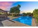 Sparkling backyard pool with lush landscaping, perfect for relaxing and entertaining at 1974 E Dubois Ave, Gilbert, AZ 85298