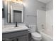 Bathroom featuring vanity, lighting, and a shower-tub combo with tile surround at 2153 E Crest Ln, Phoenix, AZ 85024