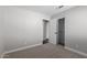 Bedroom with plush carpeting, neutral paint, and a closet at 2153 E Crest Ln, Phoenix, AZ 85024