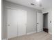 Bedroom boasts carpeted floors, neutral walls, and a closet at 2153 E Crest Ln, Phoenix, AZ 85024
