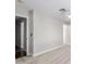 Spacious bedroom featuring neutral carpet, white trim, and multiple doorways at 2153 E Crest Ln, Phoenix, AZ 85024