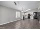 Open-concept kitchen and living area with tile floors and stainless steel appliances at 2153 E Crest Ln, Phoenix, AZ 85024