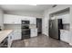 Bright kitchen with white cabinets, stainless steel appliances, and tile flooring at 2153 E Crest Ln, Phoenix, AZ 85024
