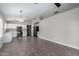 Open-concept kitchen and living area with tile floors and modern appliances at 2153 E Crest Ln, Phoenix, AZ 85024