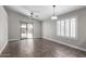 Bright living room with tile flooring, ceiling fan, and sliding glass door to the backyard at 2153 E Crest Ln, Phoenix, AZ 85024