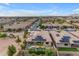 Aerial view of a home with solar panels, a pool, and desert landscaping in a residential neighborhood at 22639 E Avenida Del Valle --, Queen Creek, AZ 85142