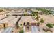 Aerial view of a single Gathering home showcasing desert landscaping, solar panels, and a two-car garage at 22639 E Avenida Del Valle --, Queen Creek, AZ 85142