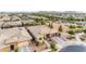 Wide aerial view of a home featuring desert landscaping, solar panels, and a two-car garage at 22639 E Avenida Del Valle --, Queen Creek, AZ 85142