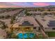 Backyard view of a single-Gathering home with desert landscaping, outdoor living space, and private pool at 22639 E Avenida Del Valle --, Queen Creek, AZ 85142