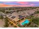 Aerial view of a single-Gathering home with solar panels, mature desert landscape, and a private swimming pool at 22639 E Avenida Del Valle --, Queen Creek, AZ 85142