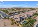 Sprawling aerial view of a community with homes featuring solar panels and desert landscaping at 22639 E Avenida Del Valle --, Queen Creek, AZ 85142