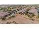 Wide aerial view of homes featuring solar panels and lush landscaping at 22639 E Avenida Del Valle --, Queen Creek, AZ 85142