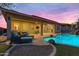 Relaxing backyard with a private pool, lounge seating, and a covered patio area at 22639 E Avenida Del Valle --, Queen Creek, AZ 85142