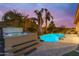 Private backyard with a hot tub, pool, and lush landscaping for ultimate relaxation at 22639 E Avenida Del Valle --, Queen Creek, AZ 85142