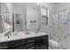Bright bathroom features a double sink vanity and shower with stylish curtain at 22639 E Avenida Del Valle --, Queen Creek, AZ 85142