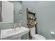 Bathroom features a pedestal sink and a ladder shelf for storage at 22639 E Avenida Del Valle --, Queen Creek, AZ 85142