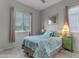 Relaxing bedroom with a bright, colorful quilt, light walls and a window for natural light at 22639 E Avenida Del Valle --, Queen Creek, AZ 85142