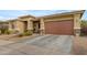Single-Gathering home showcasing a low maintenance desert front yard at 22639 E Avenida Del Valle --, Queen Creek, AZ 85142