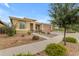 Single-Gathering home showing a low maintenance desert landscape and private front porch at 22639 E Avenida Del Valle --, Queen Creek, AZ 85142