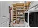 Bright laundry area offers ample shelving and a convenient vacuum cleaner at 22639 E Avenida Del Valle --, Queen Creek, AZ 85142