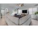 Comfortable living room features a ceiling fan and a large sectional sofa at 22639 E Avenida Del Valle --, Queen Creek, AZ 85142